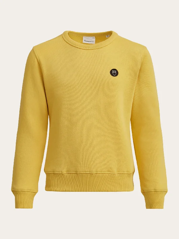 Shop the essentials – men’s wardrobe must-haves on sale. Badge crew neck sweat - Misted Yellow Shop the essentials – men’s wardrobe must-haves on sale. Badge crew neck sweat - Misted Yellow