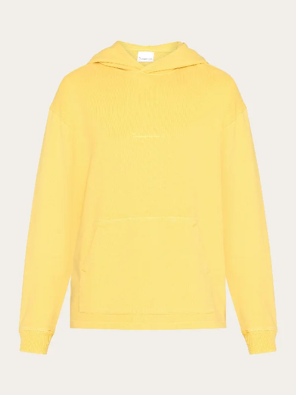 Save on stylish, high-quality clothing for every occasion – Loose fit hood sweat with logo chest print - GOTS/Vegan - Misted Yellow Save on stylish, high-quality clothing for every occasion – Loose fit hood sweat with logo chest print - GOTS/Vegan - Misted Yellow