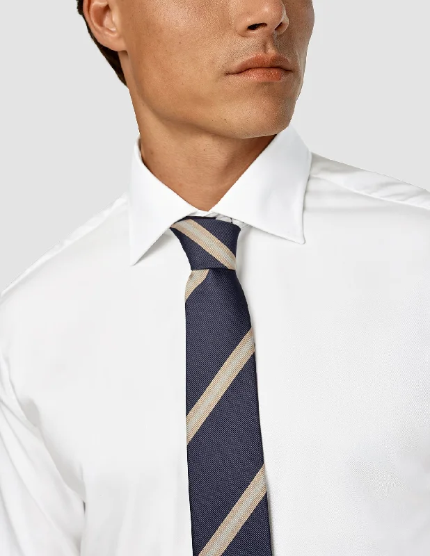 Upgrade your look with stylish, affordable men’s clothing.  Tie Navy / Beige Stripe